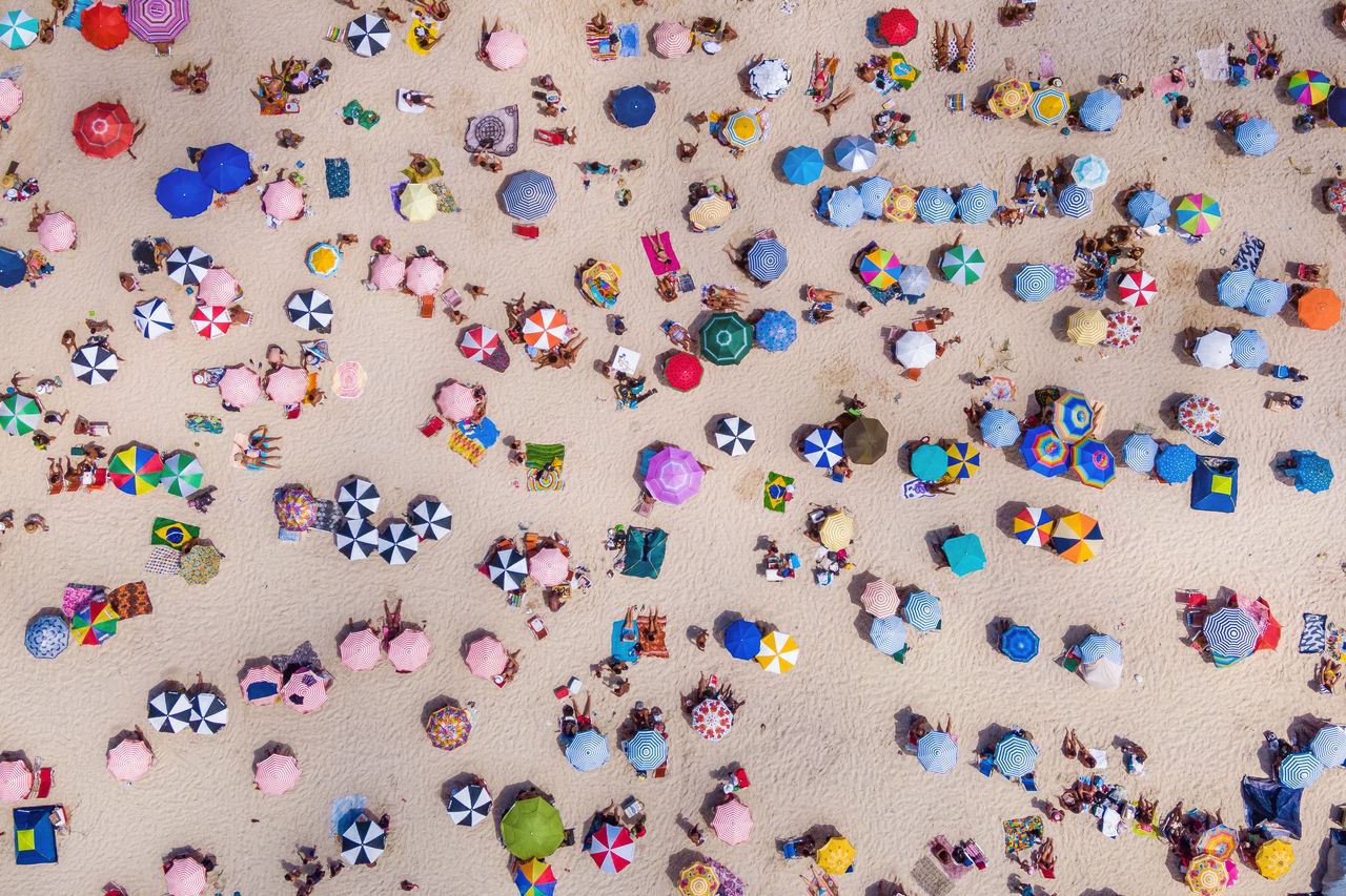 Rio de Janeiro, Brazil, top view of Copacabana Beach showing colourful umbrellas and people relaxing on a summer day. Tropical travel and vacation concept.
